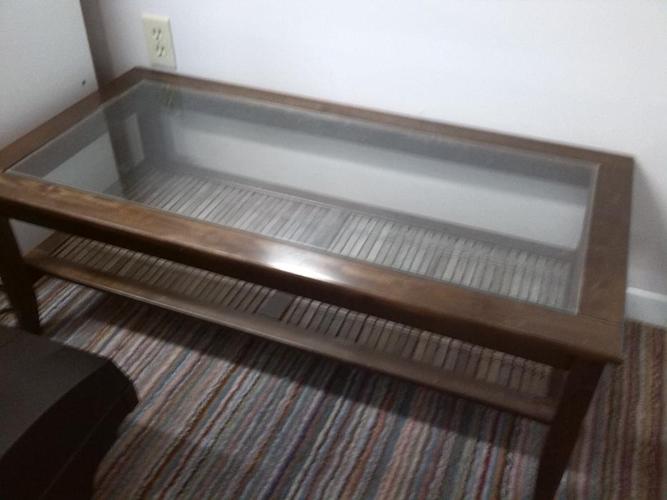 Solid wood coffee table with glass top - medium dark brown