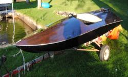 11 Foot two seater. Black hull with mahogany deck.Holds up to a 30HP. $1600.00