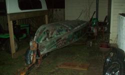 12 foot fishing boat and trailer.