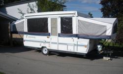 Rockwood camping trailer. Very clean and spacious, 14 foot box. Storage compartment across the front, furnace, sink, fridge, stove, king and queen size bed, sleeps 7. Two table areas that can convert to beds. Can easily be towed by a mini van.