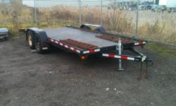 Flatdeck trailer, 2 3500lb dexter axles with brakes, brakes and bearings were done in fall of 2010, trailer has less than 6000km on it since. Deck boards in good shape, pic shows rubber mats on top, but they will be removed. Has ramps that slide in the
