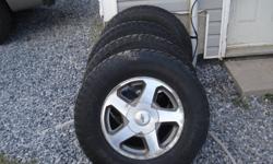 for sale 4/ 235/75r16 studed  tires and rims  wheels are from chev trailblazer phone7857611 or6400666