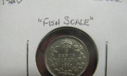This is a very fine example of the 1920 Canadian nickel, or as some may call the "fish scale".  In 1920 the 5 cent coin was debased from .925 sterling to .800 fine silver.
 
Please Dont Contact Through E-mail.
Call TnT at 705-675-3000
Or Check out Our
