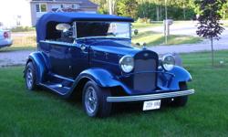 1931 Ford Replica The motor is a ford 302 with an edelbrock intake and carb and the breather is cromed. Updated with power steering and brakes.  Under the car is clean and neat with s/s exhaust  the Torck Thrust 2 --14" wheels. The abraasive strip plate