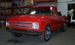 Tastefully customized classic C-10.
 
250c.i. In-Line 6 cyclinder, 3 speed manual transmission. (Shift on the column.)  12 bolt rear-end w/3.73 gear ratio. AM radio, custom painted bed floor, custom red & white interior, shaved door handles / keyless