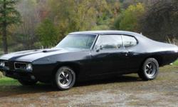 1969 Pontiac GTO.
Real GTO, Not a Clone
Runs great. Strong motor and smooth transmission.
Black exterior (original colour champagne) Complete new Gold interior (Partially installed), Bucket seats w/Console shift, Power Windows, Power Brakes, and Power