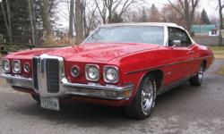 1970 Pontiac Bonneville, red convertible, white top and black interior, 455 cu. in. everything power, 27,677 miles (an American car).  Factory air, stainless steel exhaust.  80% + tread on tires, new boot.  A must see, asking $20,000  please call