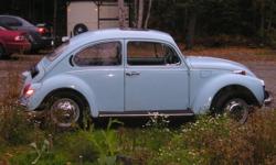 1971 VW Beetle, 1600cc dual port engine with 1200cc "doghouse" for better cooling, pertronics pointsless distributer and coil, holley 2bbl carb, aux. oil cooler and oil filter, empi headers, heads are ported and have high rev valve springs in them, fresh