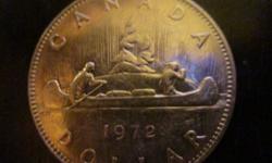 This is a 1972 Canadian dollar coin. It's made of nickel. Condition good
thanks for looking