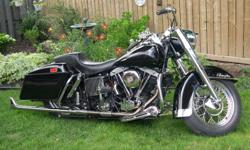 This is a 1977 Harley-Davidson Electra Glide 1200cc motorcycle that is up for sale for $7,200.00 or best offer, thanks..
 
Have a look at the photos which show the bike without a windshield which is sold with it, this was back when I first bought it,