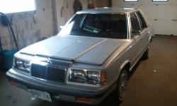 selling an 86 chrylser lebaron nicknamed "the gem" it has a little over 80 thousand kms. it was babied and restored