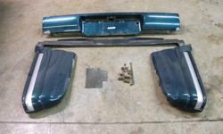 1995-1997 GMC Jimmy Rear Bumper Assembly. Will Also Fit 1995-1997 Chevy Blazers. Came off a 1997 GMC Jimmy. Comes Complete with End Caps, Filler Panel and Attaching Hardware.  Everything is Straight and in Great Shape and are all FactoryGM Parts.  Asking