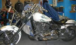 Custom Paint/Pearl White with flames
Vance/Hines Pipes
Wide Glide Front End
Lots of Chrome