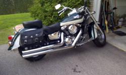REDUCED Kawasaki Vulcan 1500 Classic for sale in immaculate condition. New clutch and tires with approximately 2500 km on them. 3 inch Hard Chrome Big Straight pipes, Mustang saddle, leather saddle bags, chrome side covers and chrome drive shaft cover.