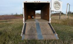 Four place snomobile trailer, quad hauler. Good condition.
Dimensions; 8'  ft. wide, 68" tall, 18 ft. long plus V-nose. Floor is approximetly 24" off the ground, with no inside wheel wells.
Front and rear ramp, drive on drive off. Front ramp was rebuilt