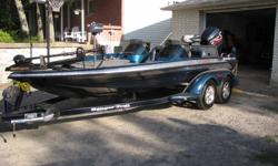 1999 ranger 518 comanchee duel console with a 2000 e tec evinrude 200hp,74lb minkota,lowrance fish finder on bow,i am the 2nd owner it has 300 hrs on complete package trailor is tandom with brand new tires complete package is all mint,bought boat and ive