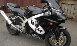 I have a 2000 Kawasaki Ninja ZX9RnCode:695184
 
The bike has:
 
full "West" fairing kit, single bubble smoked wind screen, undertail kit wit hintergrated tail lights, wheels and new gas tank are custom painted crystal black with 2k urethane paint, new