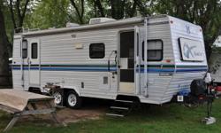 WINTER VACATION - Travel in style & comfort, 24 1/2' RV Travel Trailer, diningroom slide out, deluxe decor, full size bed, sleeps 4-6, microwave, a/c, forced air gas furnace, full awning, oven & cookstop stove, refrigerator, tub/shower, storage, cd/radio,