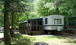 38ft with two bunks and a large screen-in porch. Located on a nice treed corner lot. Located at Cedar Cove Resort White Lake Ontario Site K11