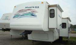 It is model number 2880RL. This unit is in excellent condition, looks great! There are two big opposing slides in the main living area making this a very spacious livable trailer. gel coat finerglass exterior, the living room has a hide a bed sofa, free