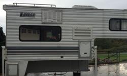 Very clean 2002 Lance short box camper. Weighs 1890 lbs fully loaded. East west queen bed, new propane burner element in fridge installed last summer. Two burner stove. New deep cycle battery last summer. Bathroom with shower. Privacy tint on Windows.