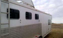 This trailer has full l/quarters. Fridge,stove,toilet,shower,a/c unit,tv/dvd player,has built in mangers and storage compartments in side of trailer. Built in hay rack and tack room with watertank for horses. Comes with a built in generater on the roof.