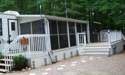2003 Northlander Legacy park model. This unit offers a bunk room with lots of storage. It also has a screen in porch with a hard top. Backing on to wooded area. Located at Cedar Cove Resort White Lake Ontario on Site H16
