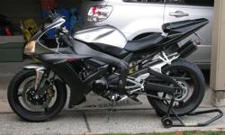 2003 Yamaha R1, Silver/Black, low mileage (29K), Akrapovic Exhaust, after market rear signal (no front signal), good threads on tires, well maintained (recent oil change and suspension adjustment).  As many guys can relate, number 2 on the