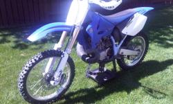 FOR SALE  2004 YZ 250 2stroke. never been raced, i ve owned this bike for about 3 years now, road trails with it maybe put on 20hrs. in awsome mechanical condition. has brand new acerbis hand gaurds, new front and rear tires, fork seals just done, as well