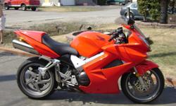 I have a VFR 800 2005 VTEC Interceptor bought new in 2007 comes with high tech alarm system ($500) and is a beautiful bike with lots of parts and manuals and stands(2). I
Also have recently replaced battery and have a Pit  Bull Single sided travel/carry