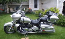 This is a great touring bike. 1300 V-4 cyl is very smooth with lots of power. Options include:  Electronic Cruise control, 4 speaker AM/FM radio with cassette and MP3 input, CB radio, Driver/Passenger intercom, 12'' and 18" windshield, Driver backrest,