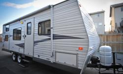 Excellent + condition, queen size bed up front, Jack and Jill bunk in the back, sleeps 7. Full size awning, outside shower, microwave, CD-AM/FM, ducted A/C, tons of storage, convenient rear side door for easy loading. There is a large custom outside
