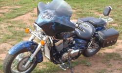 41,000 km, Direct Drive, Black and Blue Custom Paint (cost $3,000 new) , Lots of Chrome Add-Ons, Vance and Hines 'Shorty' Pipes (nice rumble) Blue LED Under-Lighting, Custom Studded Leather Seat w/Backrest and Rack, Matching Airbrushed Bat-Wing Fairing