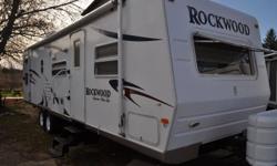 THIS VERY CLEAN ROCKWOOD SIGNATURE ULTRA LITE 33' BUNKHOUSE FEATURES A FRONT QUEEN BED AND A REAR 4 BUNKS WITH A 12 FT. SLIDE OUT LIVING ROOM NEUTRAL COLOURS, OPTIONS INCLUDE POLAR PACKAGE,DUCTED ROOF AIR , AWNING, LCD TV AND SURROUND SOUND STEREO SYSTEM