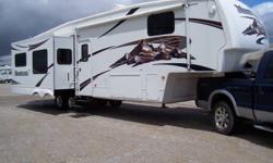 Just Reduced - All Used 5th Wheels Must Go!
This trailer has all the most desirable options. 3 slideouts, fireplace, ceiling fan, aluminum wheels, Mor-Ryde axles, microwave/convection oven, large entertainment center, 2 recliner chairs, free standing