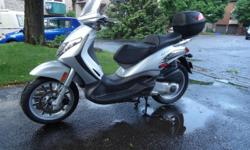 Piaggio BV250 scooter. Original owner, low mileage and immaculate condition. Includes both keys, the key card, owner manual, bottle of touch-up paint and bottle of clear coat paint, removable rear locking case, stainless reusable oil filter. Always used