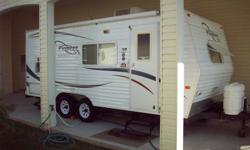 18 ft Travel Trailer made by Fleetwood.  Sofa bed, rear single bunk with lower double bed.  Full bathroom.  Fridge/freezer, microwave, 3 burner stove with oven, double sinks, dinette.  AC and furnace, awning, stabilizer jacks, outside shower, 2 inch