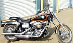 2008 Harley Davidson FXDWG, Dyna Wide Glide. Stage one was done in 2009 with screaming eagle cold air intake, V&H short shot slip on pipes. Bars were changed to street slammers at time of purchase by the dealer. Grips, pegs, shifter and brake pedal have