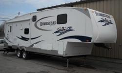 Very popular layout with a new twist. Sofa also makes a day bed, bedroom slide allows for large storage area's in bedroom. This unit has a king bed and several other options.
e-mail now and qualify for two "FREE" nights of camping
Easy Financing
Extended