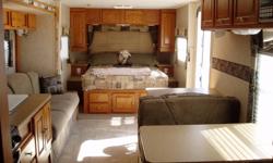 ROCK BOTTOM PRICE
This is a great trailer in very good condition.  It is 31 ft overall length with a slide.  Sleeps 9.  Easily towed by a 1/2 ton pickup or SUV. 
-Front queen size bed that is heated with privacy curtain
-Double bunk in read (single and