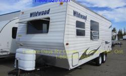 2010 Forest River Wildwood T22 Travel Trailer for sale.
This 22' unit is in nice condition and has a dry weight of approximately 4,093 lbs.
Features include:
- Sleeps up to six (double bed with one bunk, plus dinette and sofa convert to beds)
- Kitchen