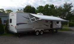 Mint condition family bunkhouse! Kids have their own private room which slides out. Near perfect layout will sleep 10. Extendable kitchen table seats 6 adults comfortably. 2 slides in total. Huge full power awning, power tongue jack. Queen size master