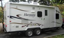 2011 21' Harmony Travel Trailer with Slide. Jacknife sofa, queen size bed, fridge/freezer, stove, microwave, furnace, A/C, hotwater, stereo system, 19" flat screen T.V, bathroom with shower, outside shower,sleeps four & awning. New from U.S. Phone