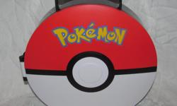Hello, we are selling a plastic case made in 2011 by Jakks Pacific. The front look like a Pokeball and inside is small compartments for the small PVC Pokemons.
The case is pretty tall, I included a pop can in one photo to show its height. I don't have any