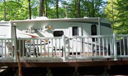 30FT with bunk house. large 12 X 26 deck and beautiful interlock fire pit. Nice treed lot. Located at Cedar Cove Resort, White Lake Ontario Site G12