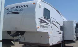 2011 CLEARANCE TO MAKE ROOM FOR 2012 MODELS
WAS $31,990.00 NOW $29,990.00
The Rockwood 8265 is a very spacious floorplan with two opposing slides in the living room giving you plenty of room to entertain.
Features include; ceiling fan, hide-a-bed,