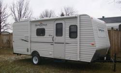 Don't worry about 'popping' out ends and putting away when wet ! This unit can be towed with mini-van... only 2540lbs... and fits in your driveway- no problem. 
 
Queen front with bunks in the back, large fridge with deep freezer, wall air conditioner