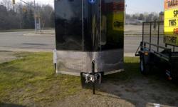 2012 Interstate Enclosed Cargo Trailer w/ Wedge 6x10
 
Features:
4" Drop axle (3500lb.)
Ez-lube hubs w/ grease caps
15" Tires
32" Side door entry
Double rear barn doors
Door tie backs on all doors
Dome light w/ switch
LED tail lights
3/8" Plywood walls