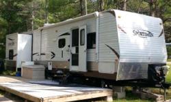 This trailer has only traveled twice.
* Has 3 slides, over 33 feet long and sleeps 10 comfortably!
* Has a front bedroom with Queen Size Bed, 2 doors, and ample storage.
* Living room with super slide housing a U-shaped dinette booth & tri-fold sofa bed.
