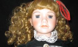 Name plate says"Elizabeth"
electric on/off switch
porcelain head and arms